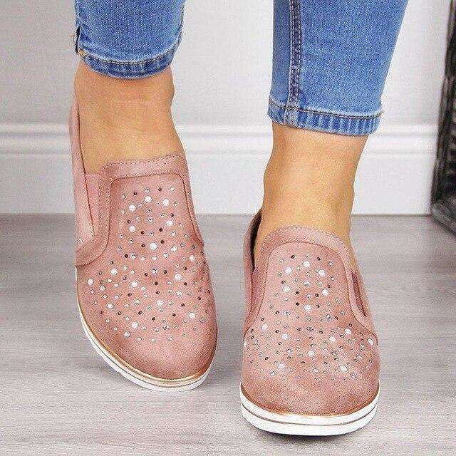 Glitzernde vulkanisierte Schuhe